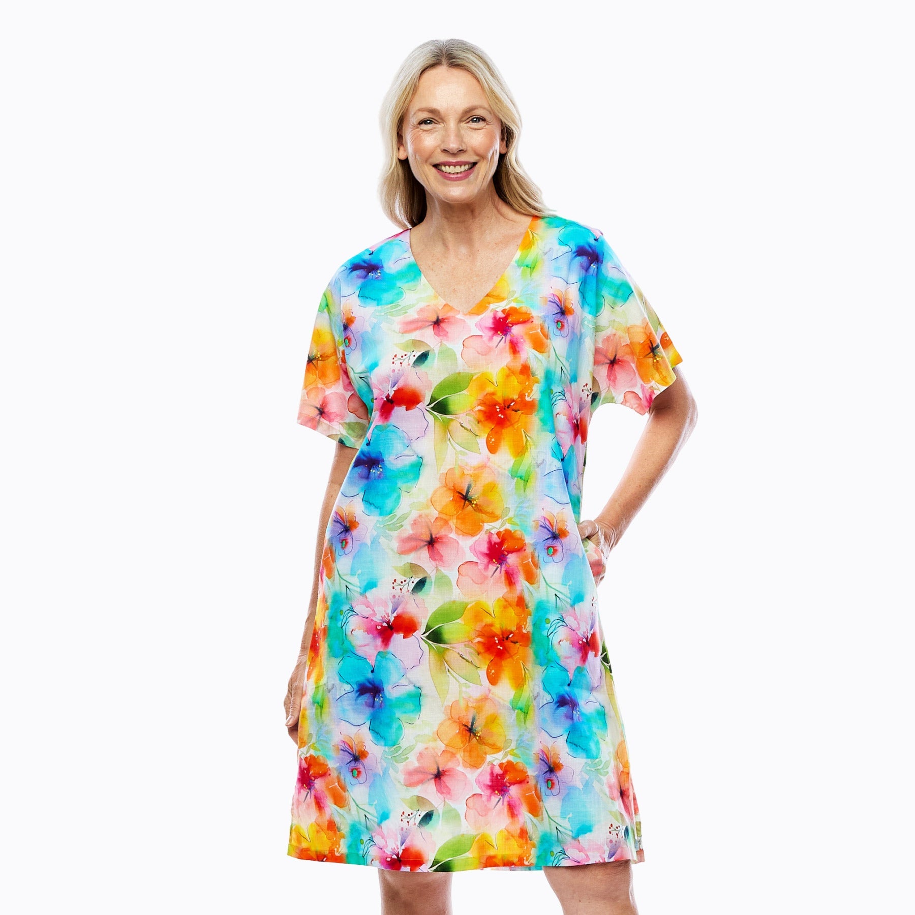 Woman wearing Claire Powell V-neck floral dress, colorful, eco-friendly, stylish women's clothing