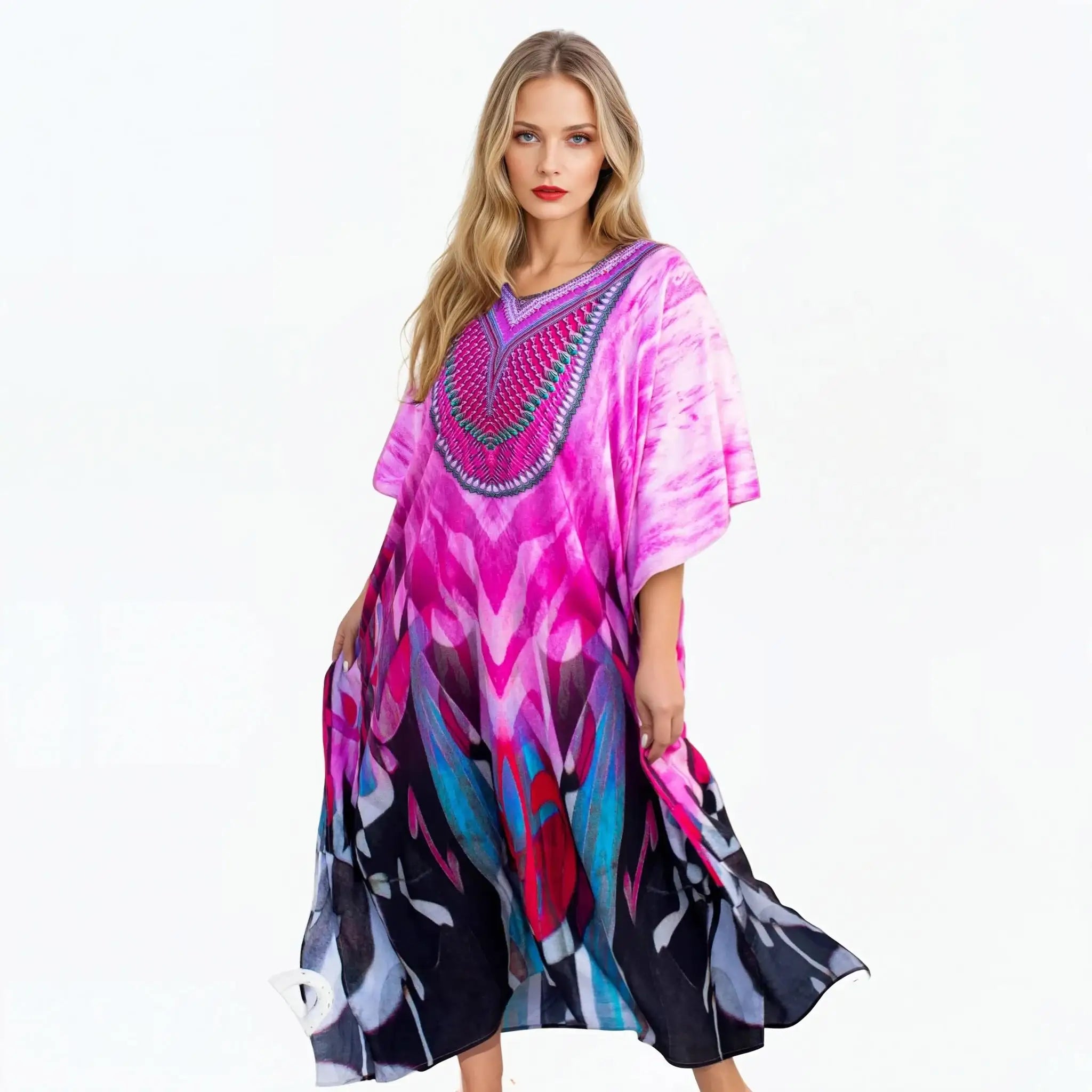 Woman modeling a vibrant pink and blue kaftan dress from Claire Powell on white background