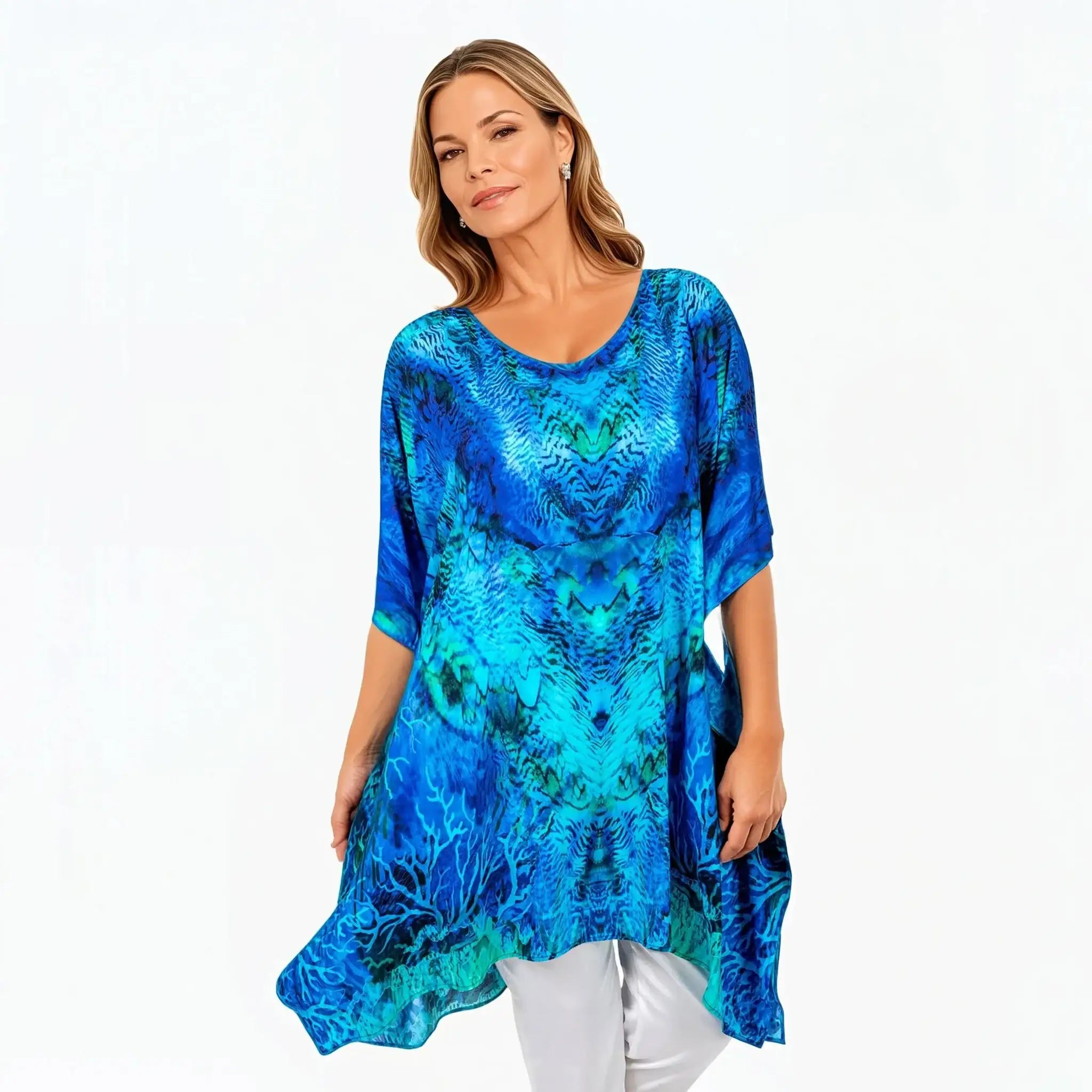 Woman wearing a vibrant blue printed kaftan top by Claire Powell, eco-friendly women's fashion