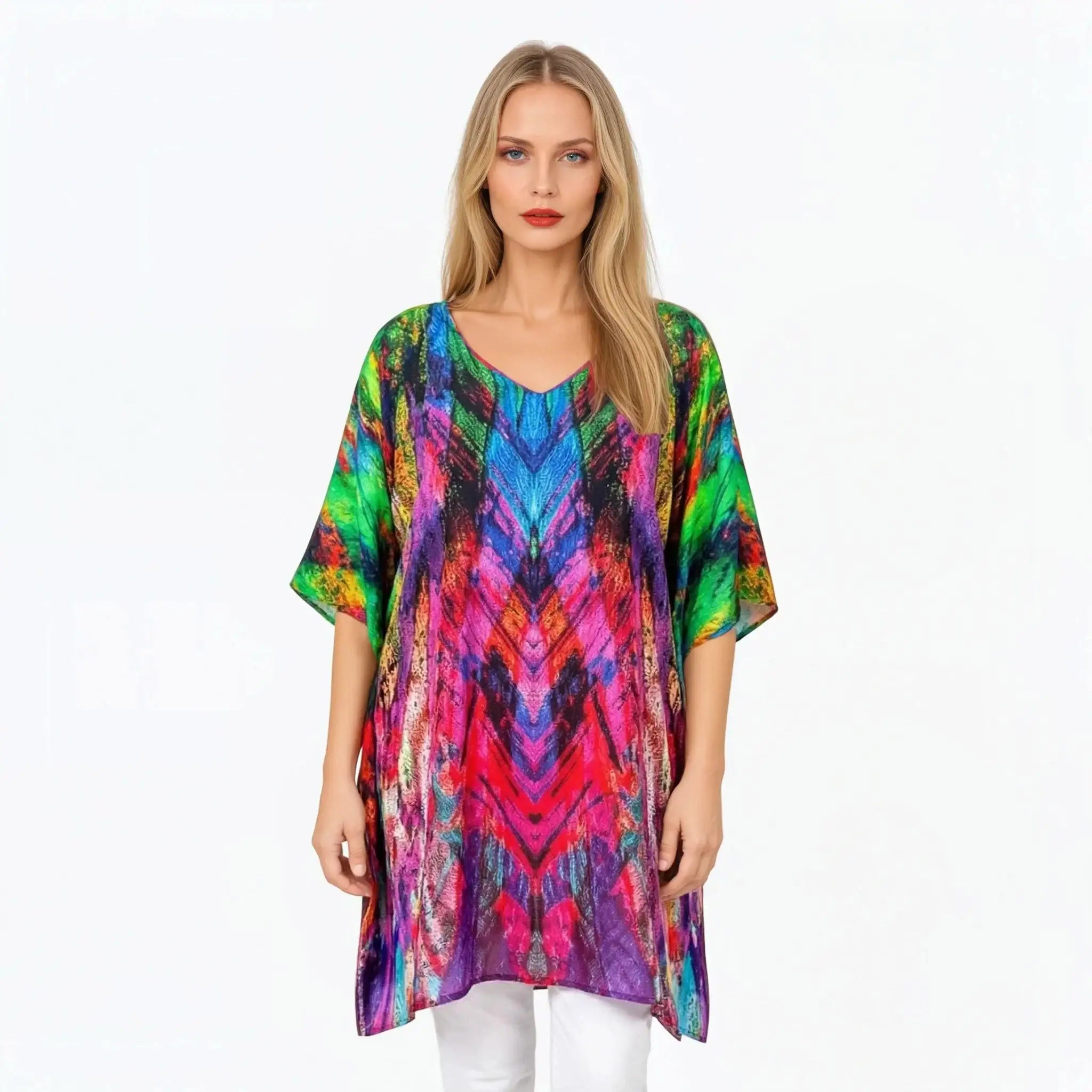 Woman wearing Claire Powell colorful mini kaftan with vibrant print, stylish eco-friendly fashion