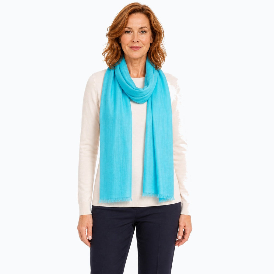 Woman wearing the Claire Powell Aqua Silk Wool Scarf, front view