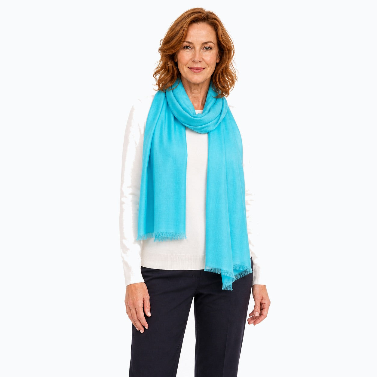 Woman wearing the Claire Powell Aqua Silk Wool Scarf, three-quarter view