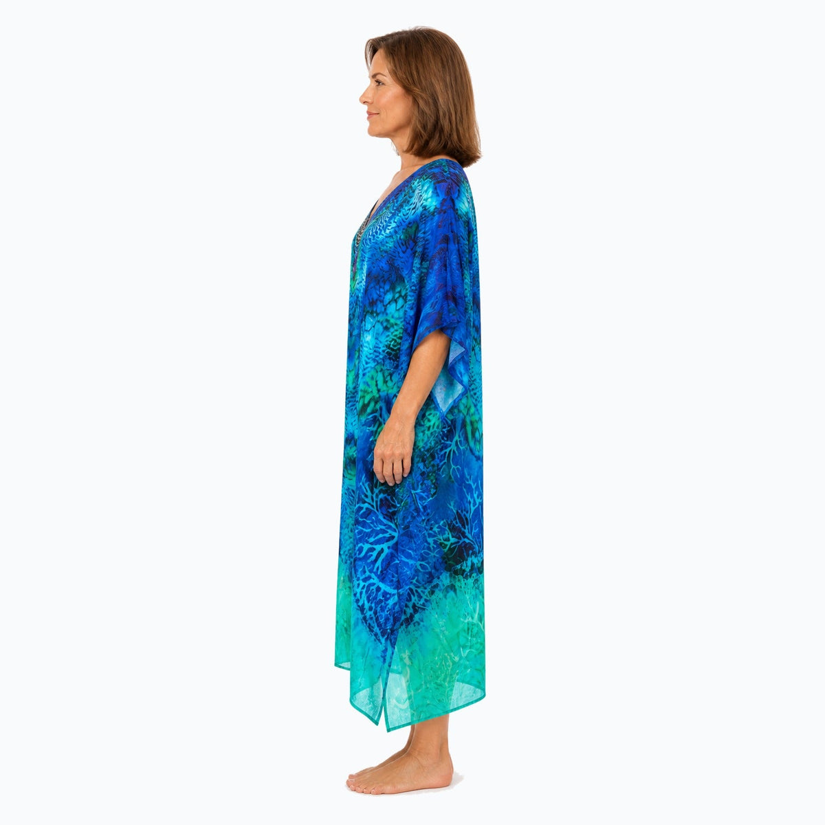 Claire Powell Aquatica midi kaftan dress on a mature woman, side view