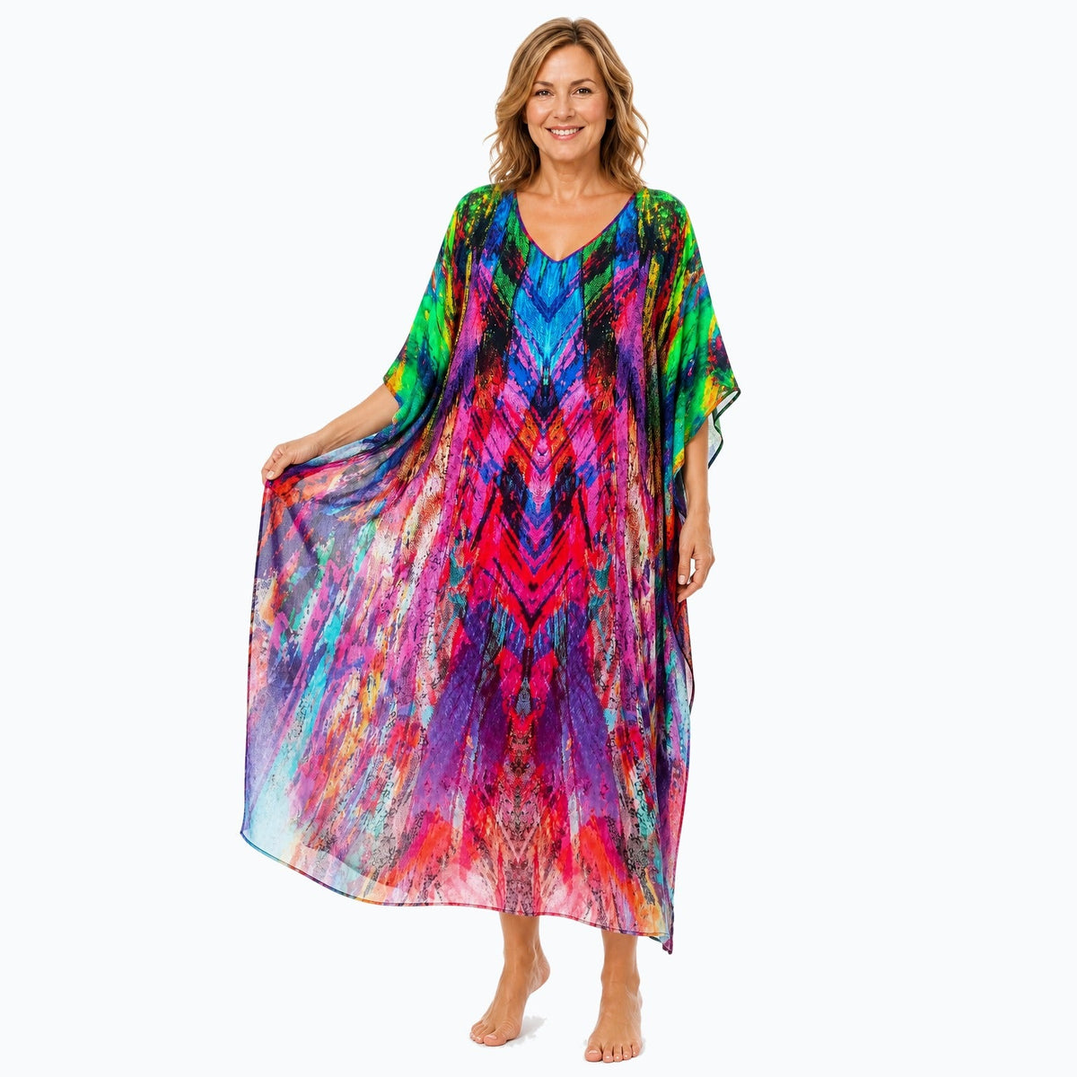 Claire Powell Carnival midi kaftan dress on a mature woman, fabric-showing pose