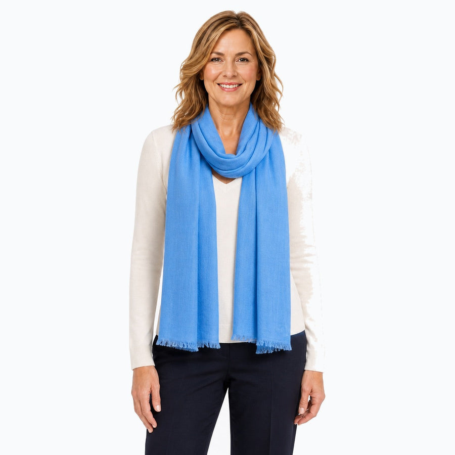 Woman wearing the Claire Powell Denim Blue Silk Wool Scarf, front view
