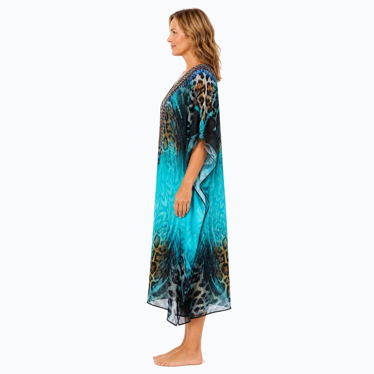 Claire Powell Jungle midi kaftan dress on a mature woman, side view