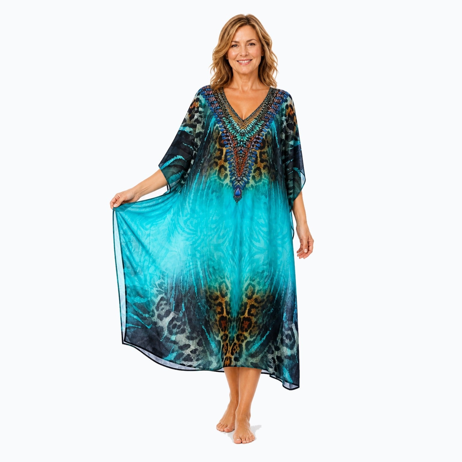 Claire Powell Jungle midi kaftan dress on a mature woman, fabric-showing pose