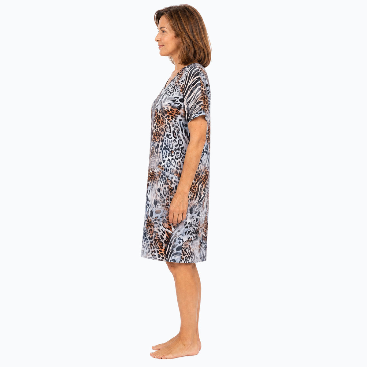 Woman wearing the Claire Powell Jungle Shift Dress, side view