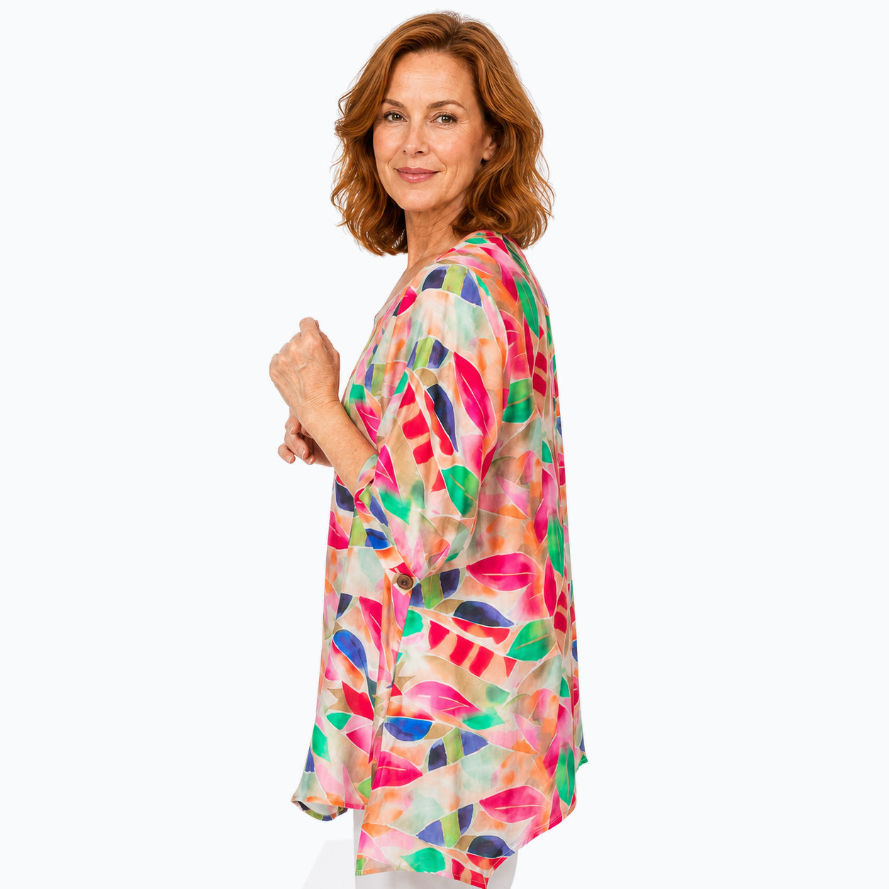 Woman wearing the Claire Powell La Peach A-Line Tunic Shirt, side view