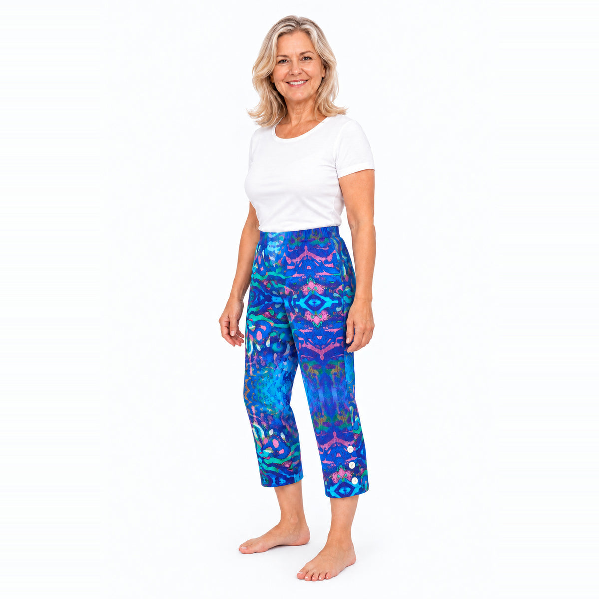 Woman wearing Claire Powell Mirage capri pants, three-quarter view