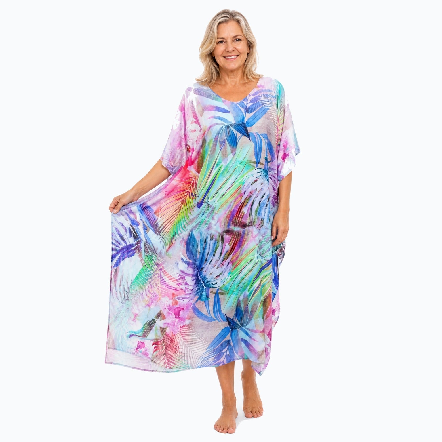 Claire Powell Oasis midi kaftan dress on a mature woman, fabric-showing pose