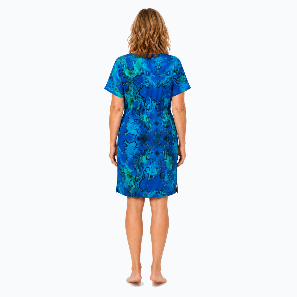 Woman wearing the Claire Powell Reef Shift Dress, back view