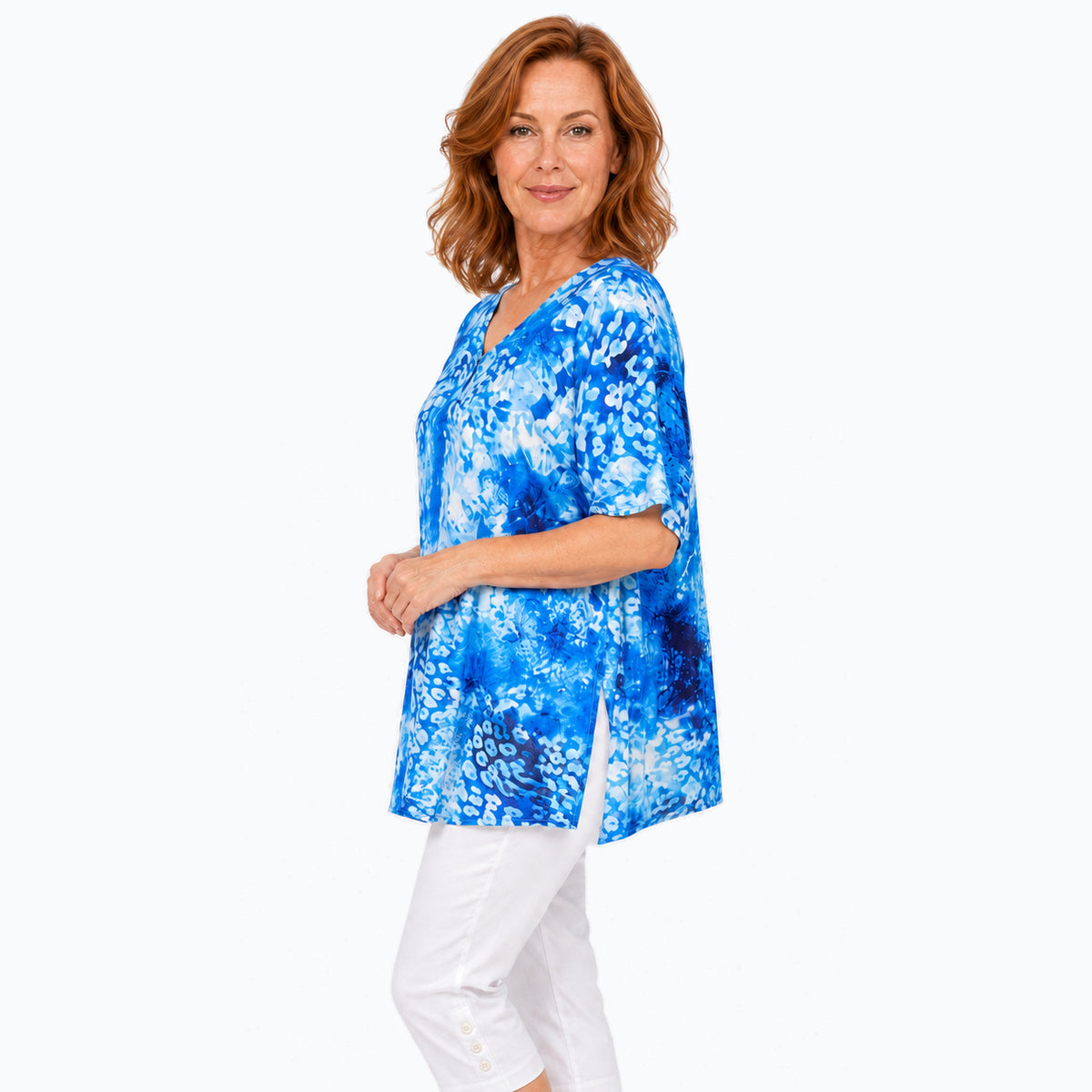 Woman wearing the Claire Powell Snowcat A-Line Tunic Shirt, true side view