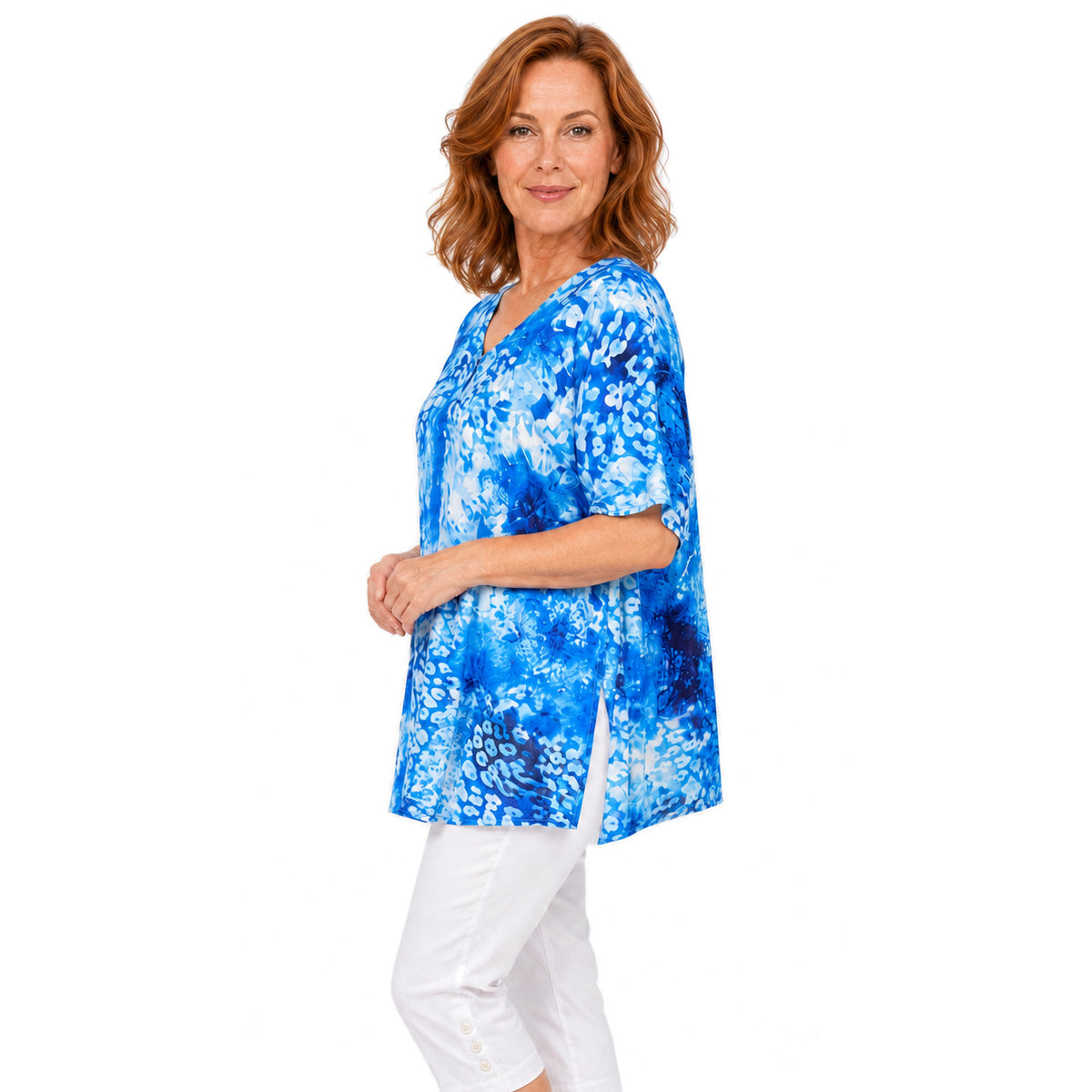 Woman wearing the Claire Powell Snowcat A-Line Tunic Shirt, true side view