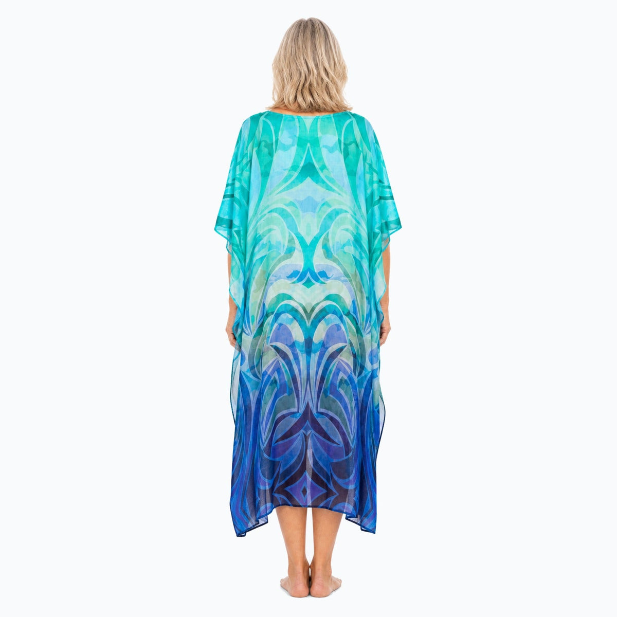 Claire Powell Waves midi kaftan dress on a mature woman, back view
