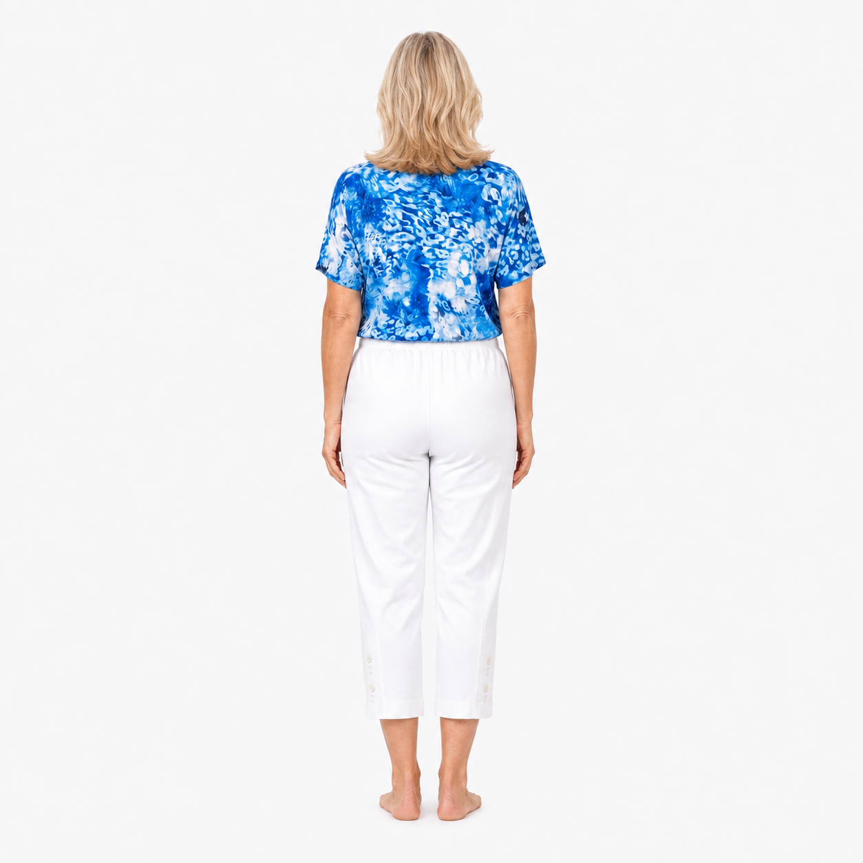 Approved Model B wearing Claire Powell White Cotton Lycra Capri Pants, barefoot back view