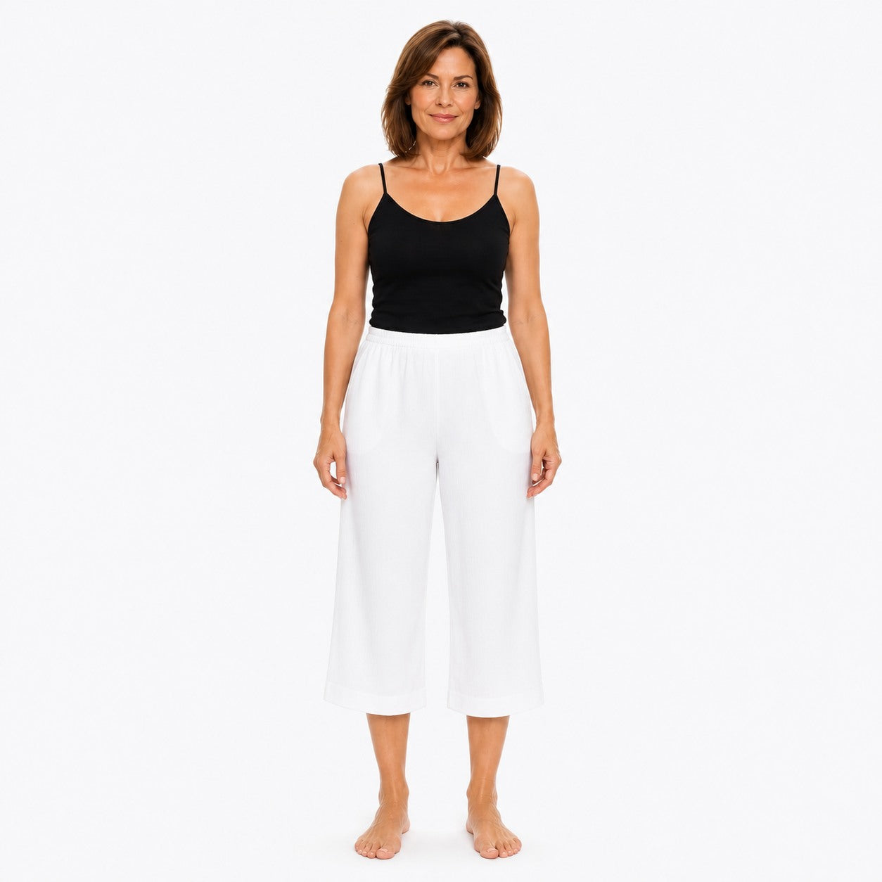 Woman wearing the Claire Powell White Viscose 7/8 Pants, front view