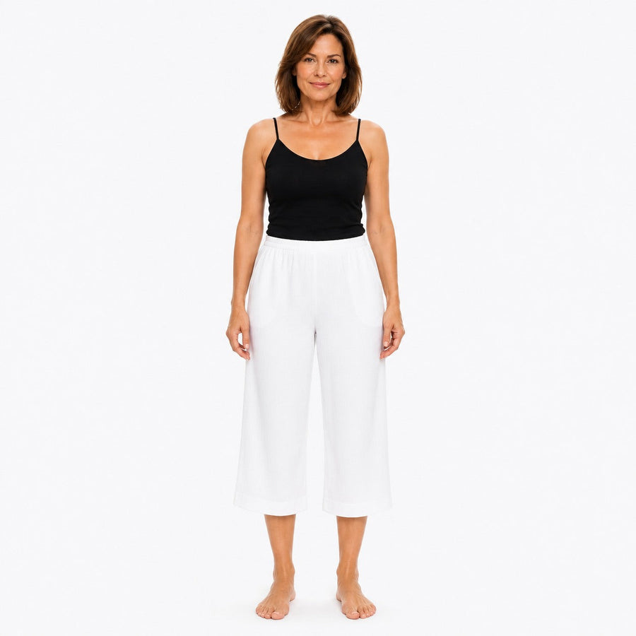 Woman wearing the Claire Powell White Viscose 7/8 Pants, front view