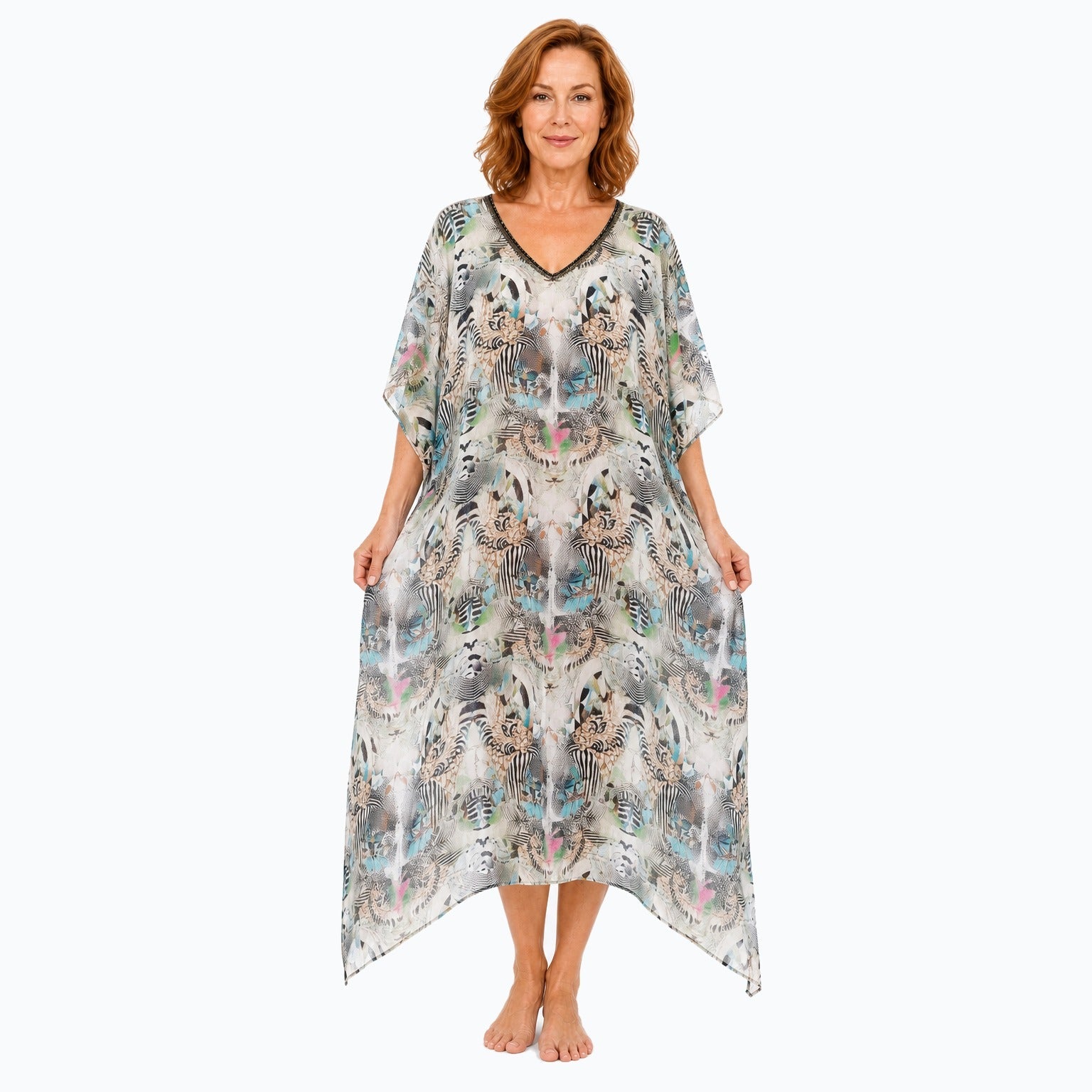 Claire Powell Zebra midi kaftan dress on a mature woman, fabric-showing pose