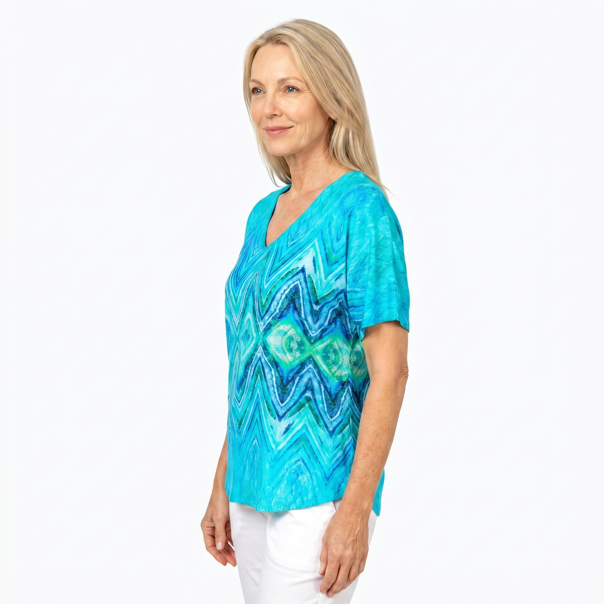 Woman wearing Claire Powell V-Neck T-Shirt in Serenity print, side view, white studio background
