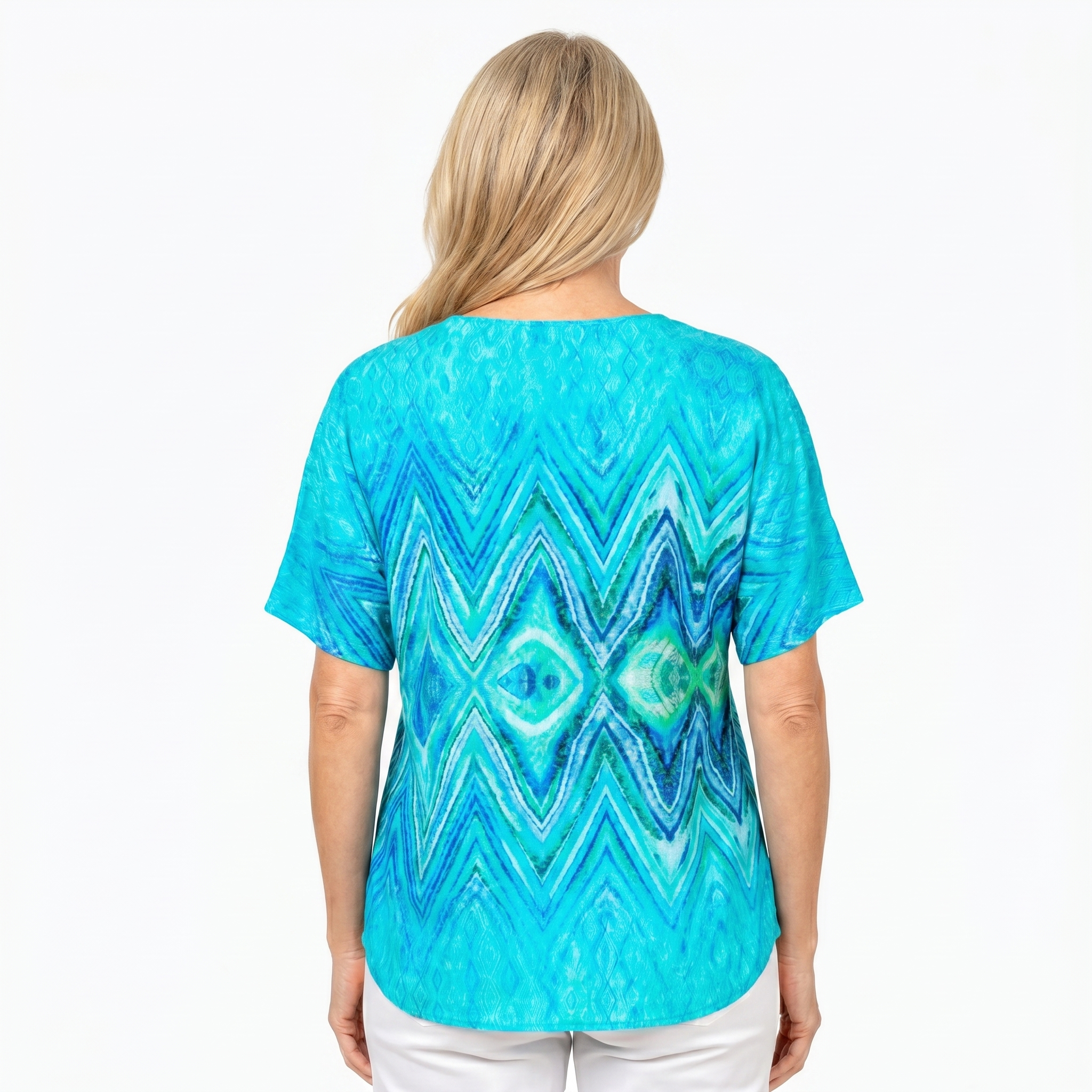 Woman wearing Claire Powell V-Neck T-Shirt in Serenity print, back view, white studio background