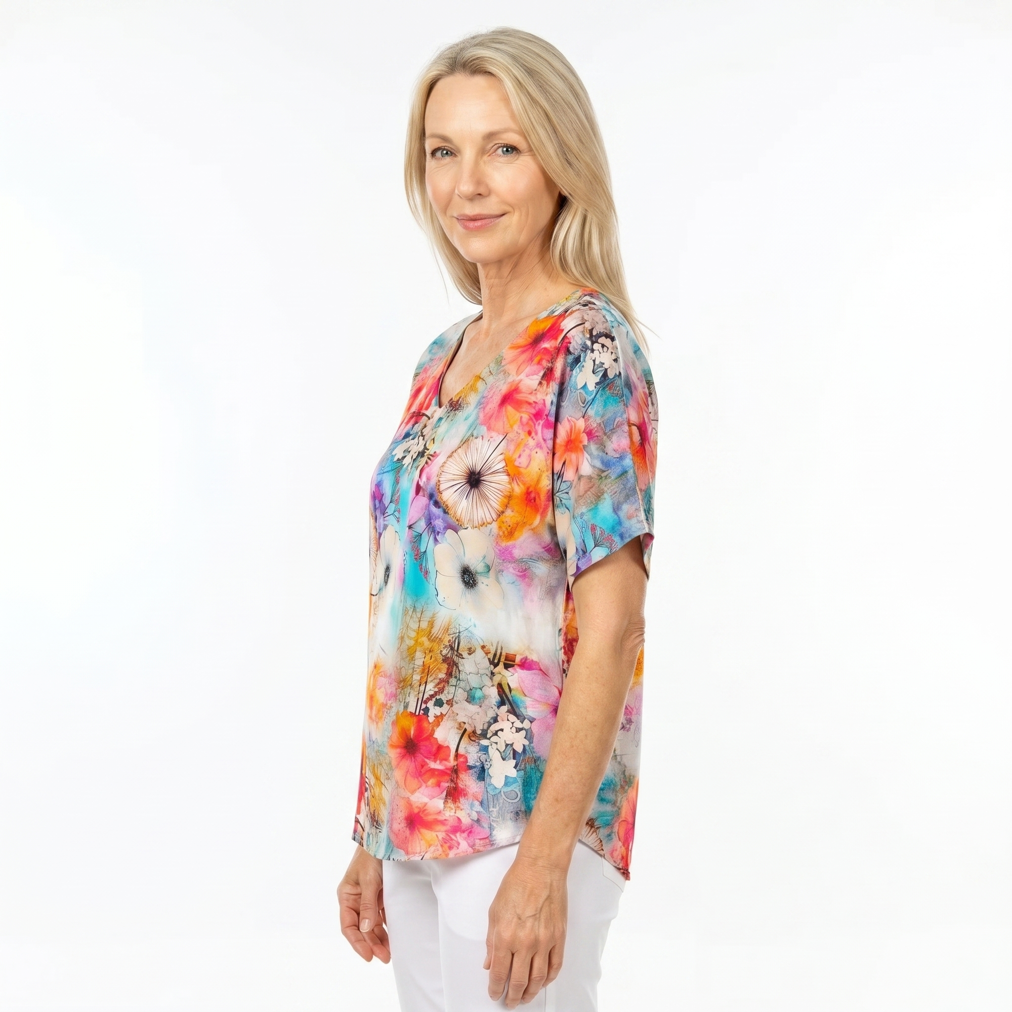 Woman wearing Claire Powell V-Neck T-Shirt in Zen print, side view, white studio background