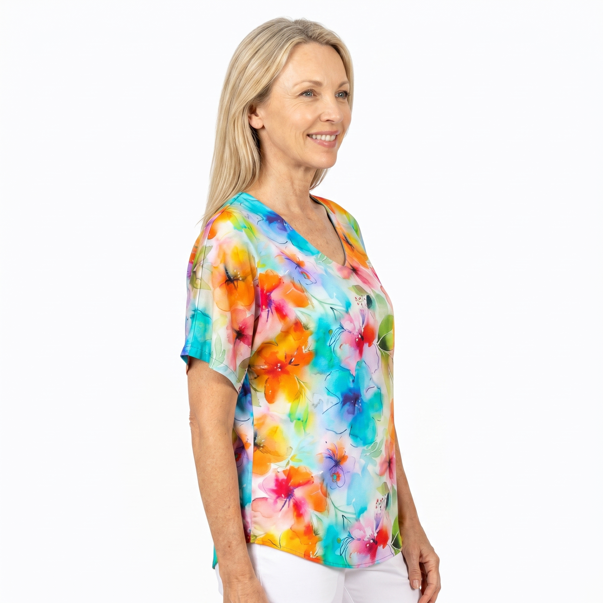 Woman wearing Claire Powell V-Neck T-Shirt in Blushing print, side view, white studio background