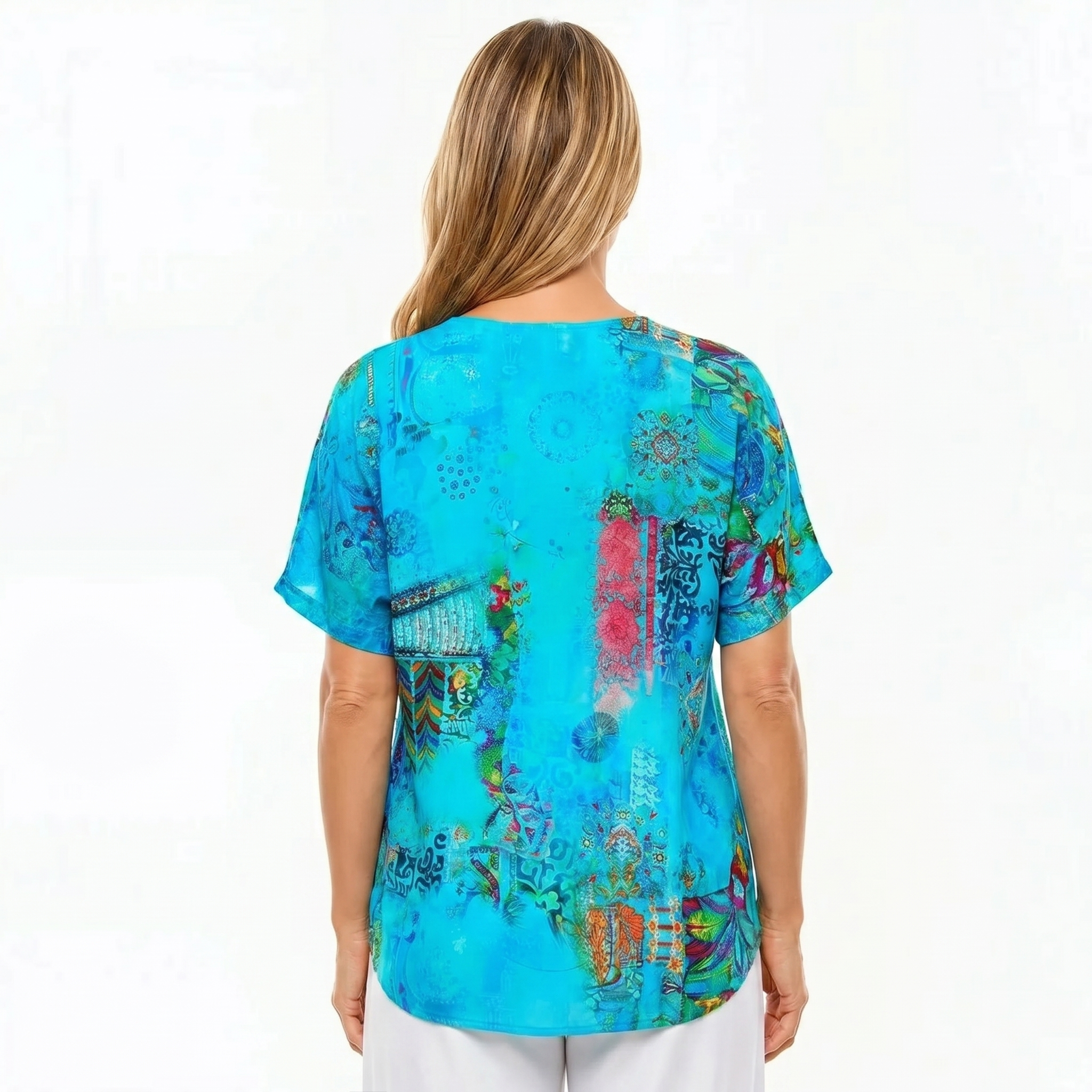 Woman wearing Claire Powell V-Neck T-Shirt in Paradise print, back view, white studio background