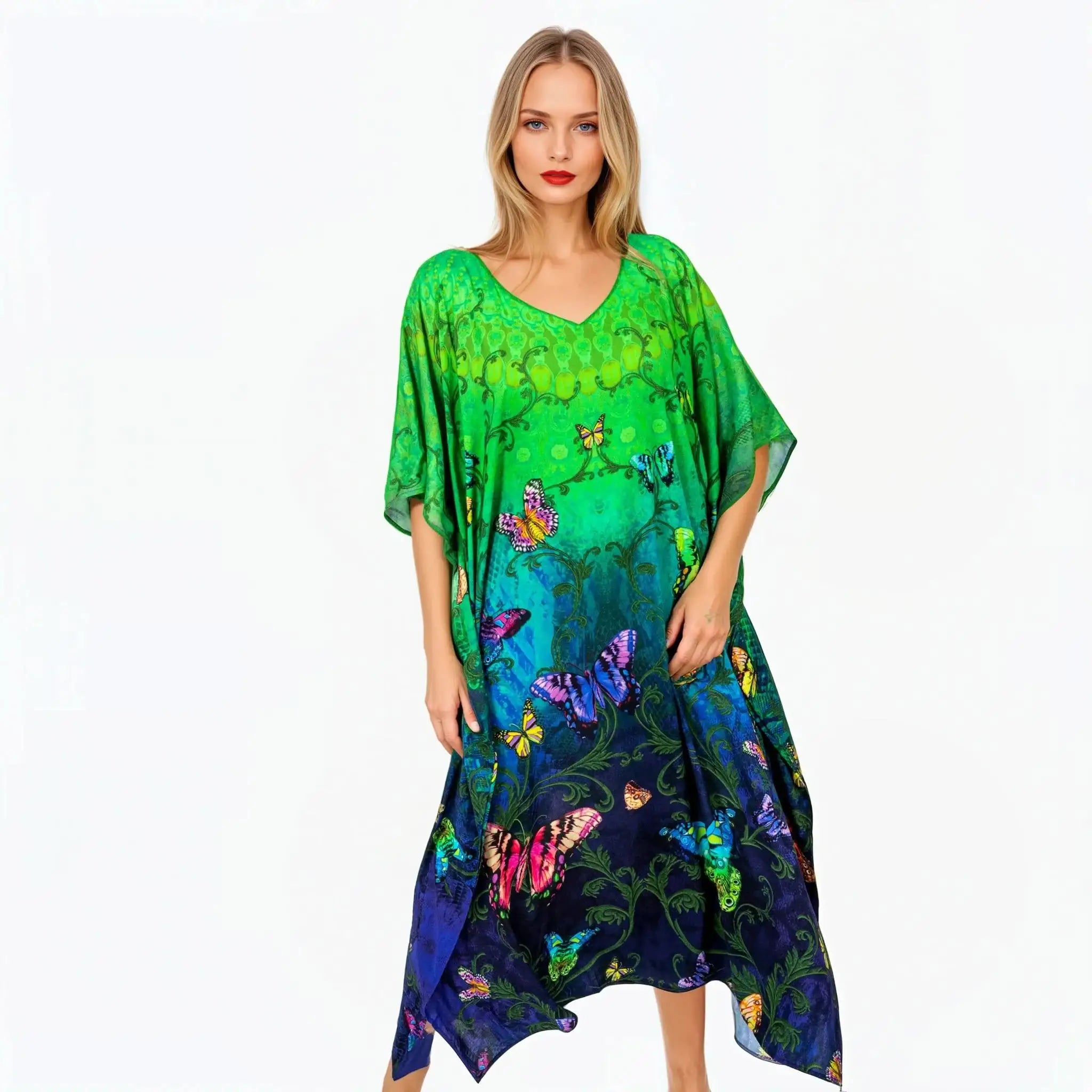 Woman wearing Claire Powell green and blue butterfly print kaftan dress, elegant and eco-friendly style