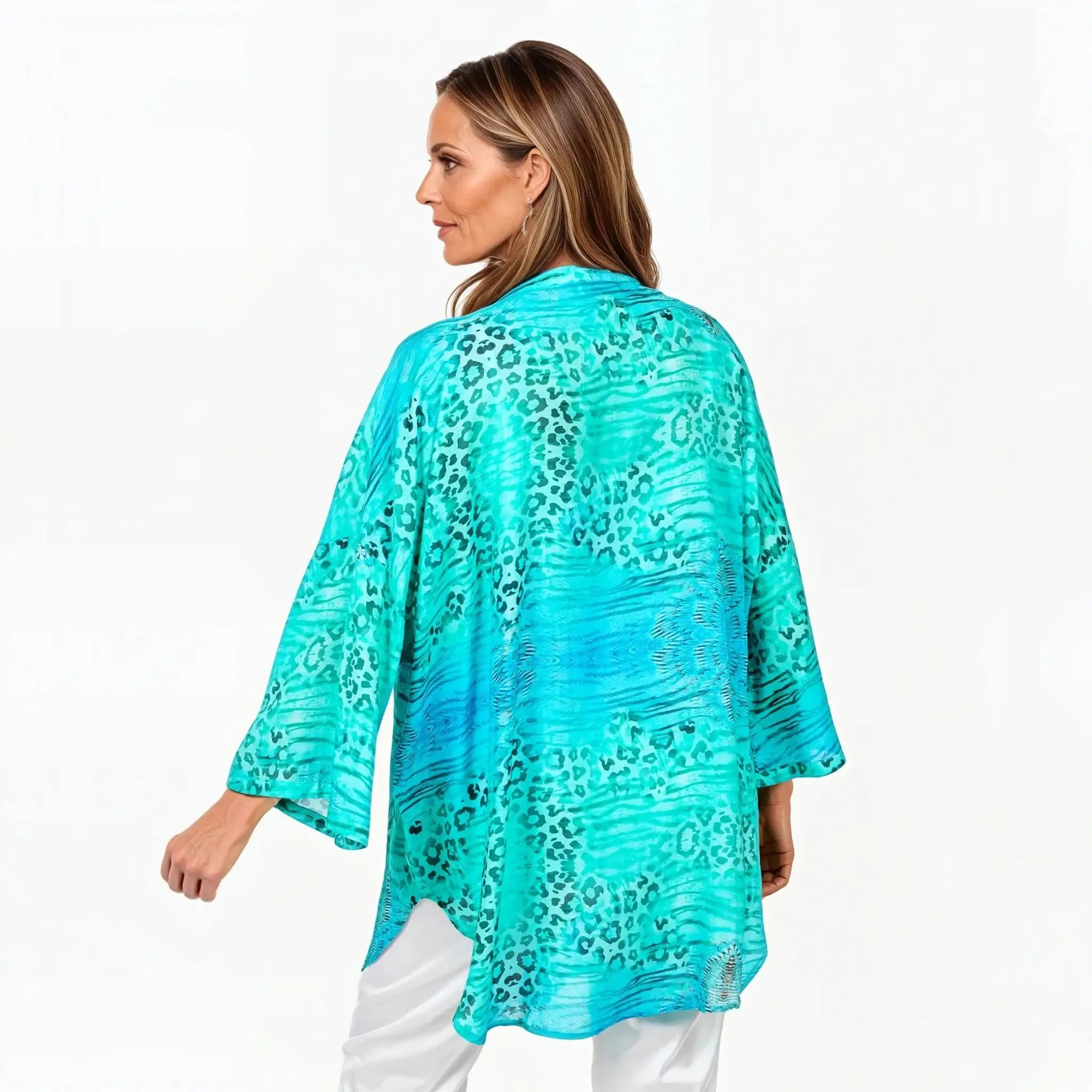 Woman wearing a turquoise animal print kimono by Claire Powell, eco-friendly women's fashion