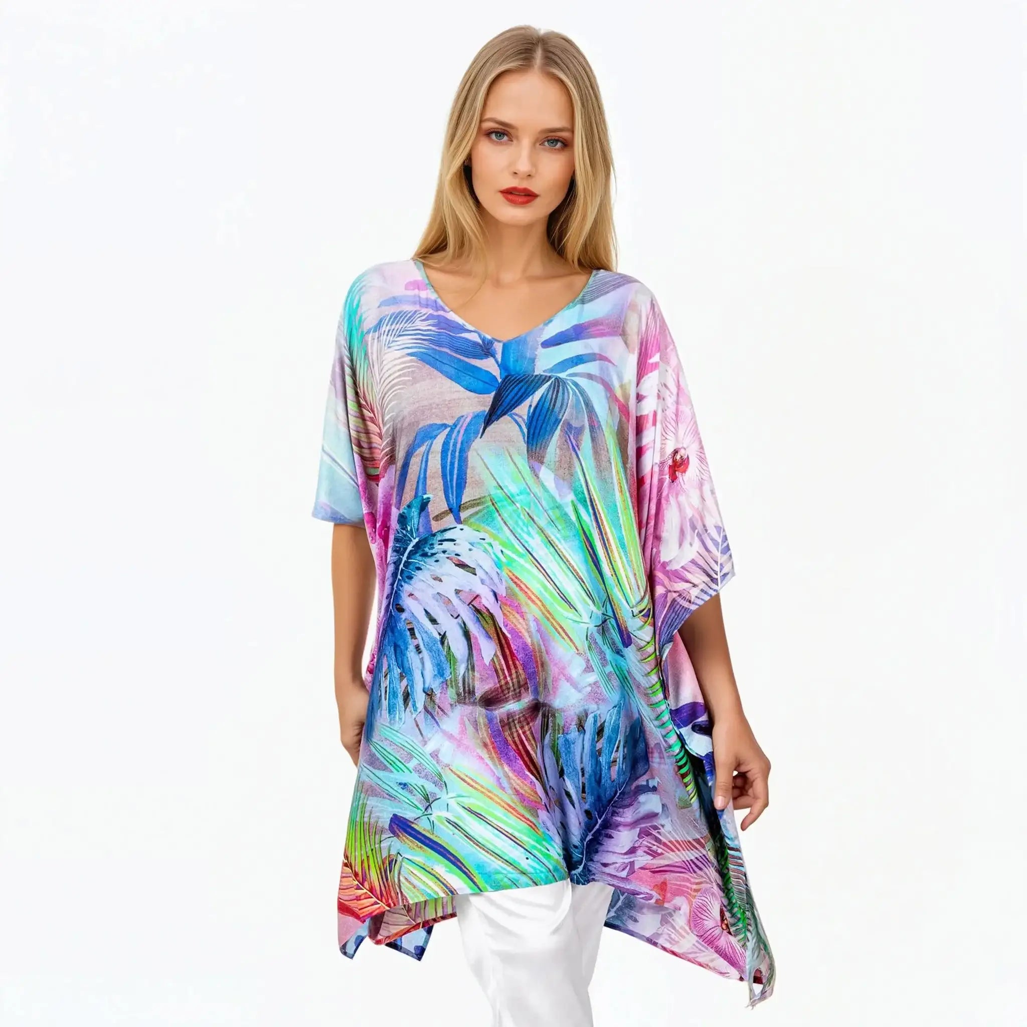Woman wearing colorful tropical print mini kaftan by Claire Powell, eco-friendly women's clothing