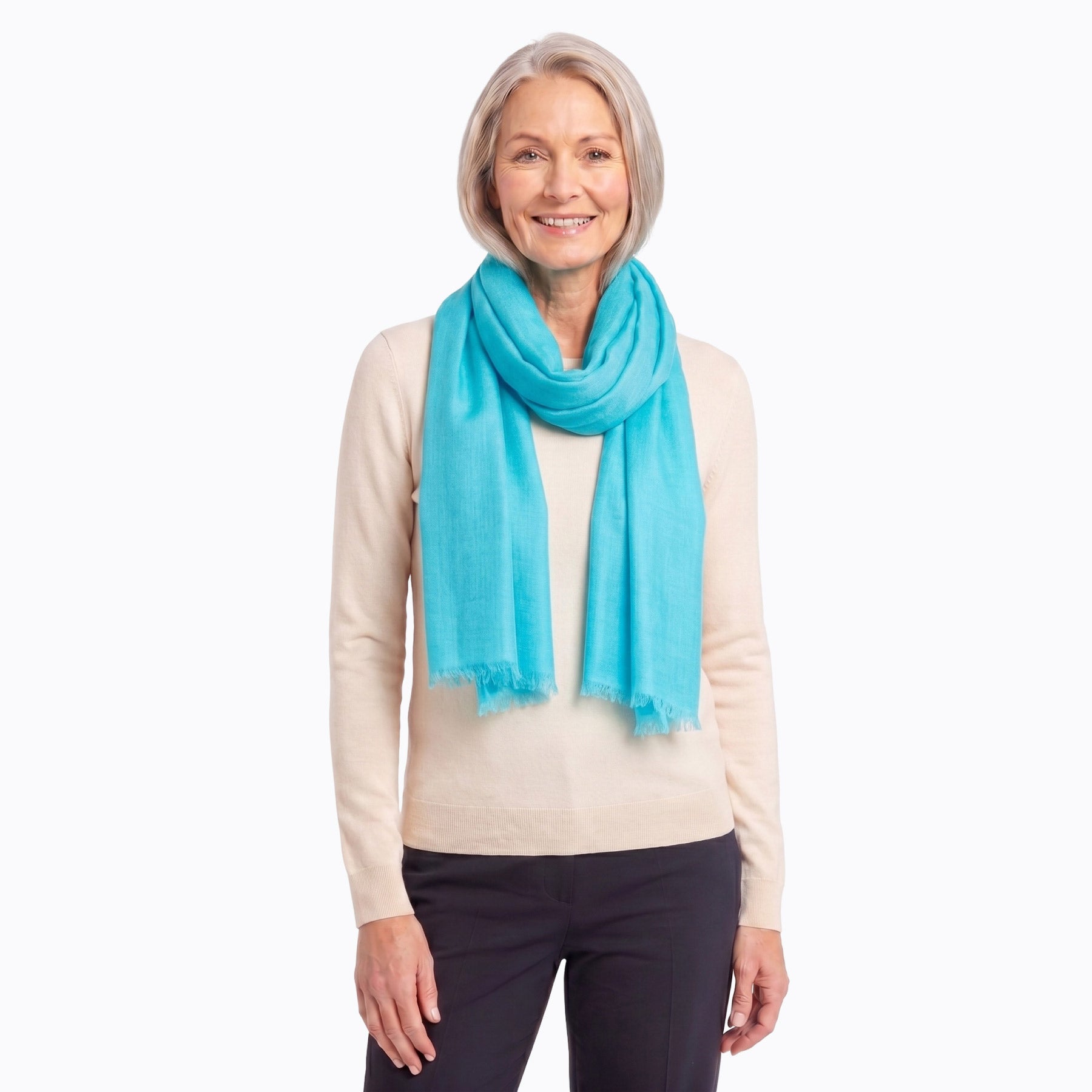 Aqua wool silk scarf draped over the shoulder - Claire Powell