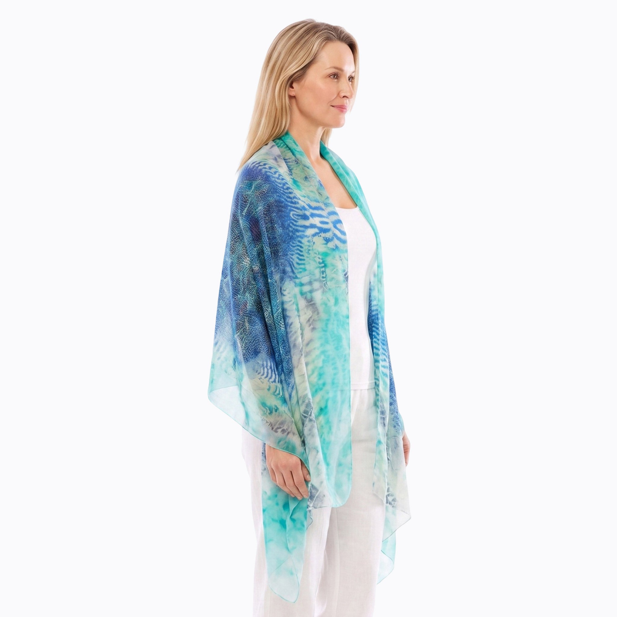 Claire Powell Silk Scarf in Marine print, blue and turquoise mulberry silk, draped over the shoulder