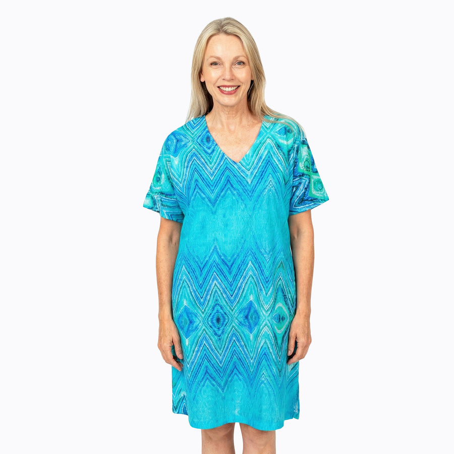 Woman wearing Claire Powell Shift Dress in Serenity print, soft blue, aqua and white, front view