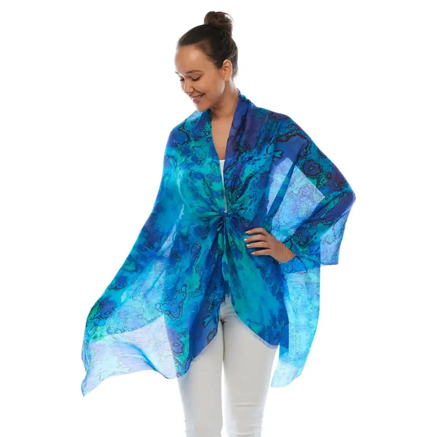 Woman wearing blue patterned kimono kaftan from Claire Powell, eco-friendly clothing