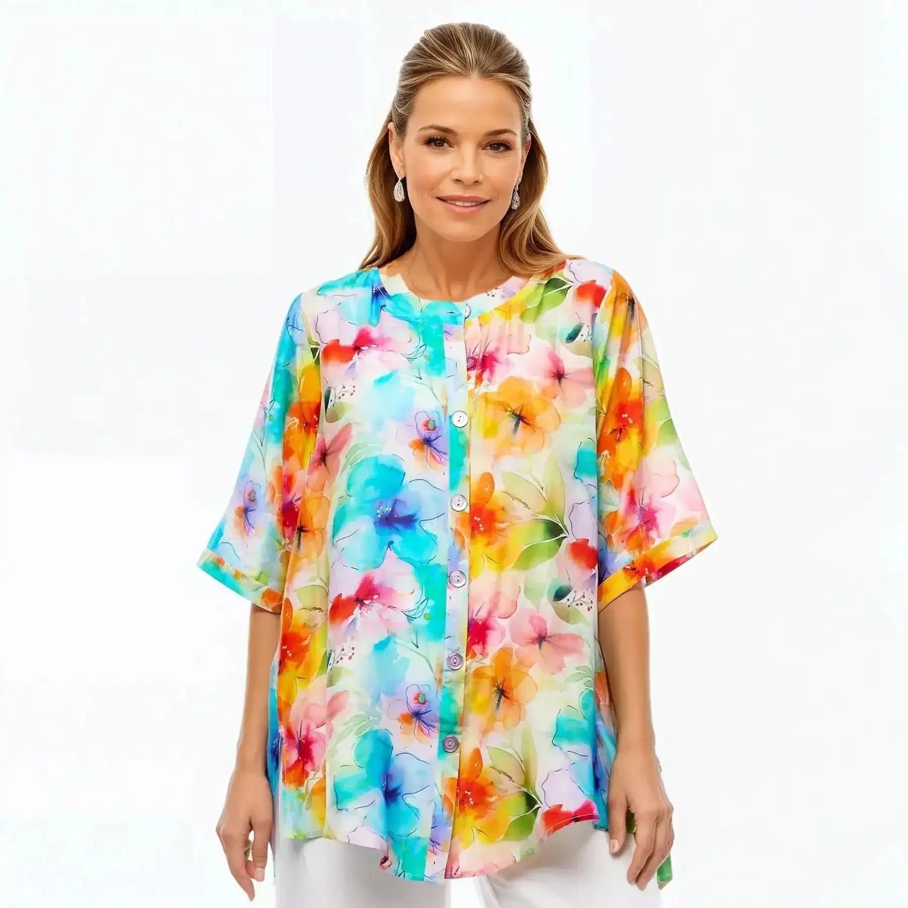 Woman wearing a colorful floral A-line tunic blouse by Claire Powell, eco-friendly fashion.