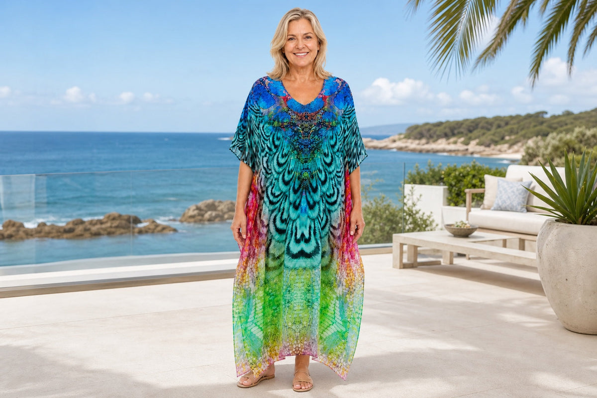 Mature woman wearing the Aves kaftan at an Australian coastal resort