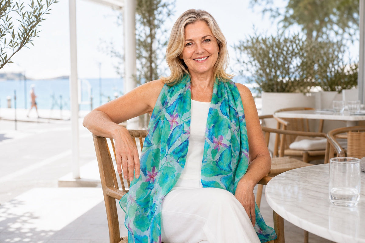 Mature woman styling the Broome silk scarf with a white summer outfit