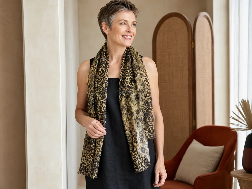 Woman styling a Claire Powell Wilden silk scarf