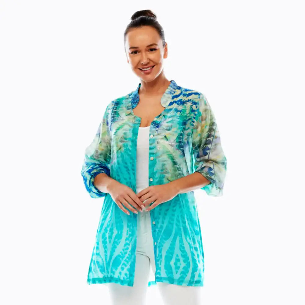 Woman wearing Claire Powell aqua blue patterned ladies shirt, eco-friendly, front view