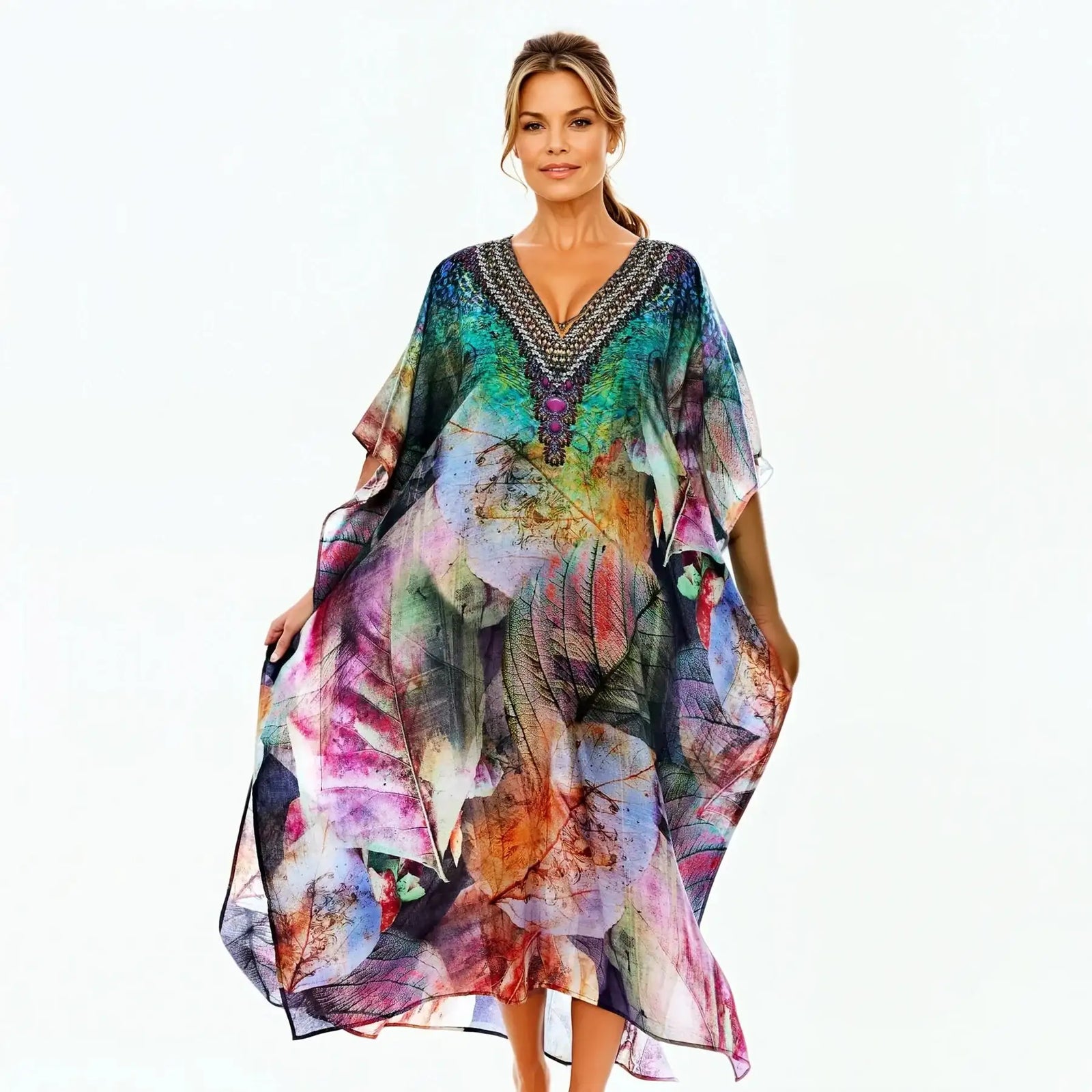 Woman wearing colorful leaf print kaftan dress by Claire Powell, eco-friendly fashion
