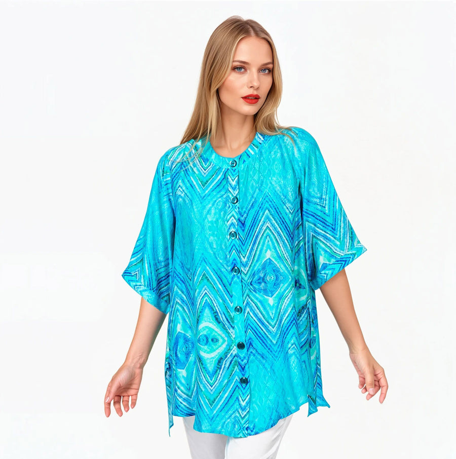Woman wearing Claire Powell A-line Tunic Blouse in Serenity print, soft blue, aqua and white, front view