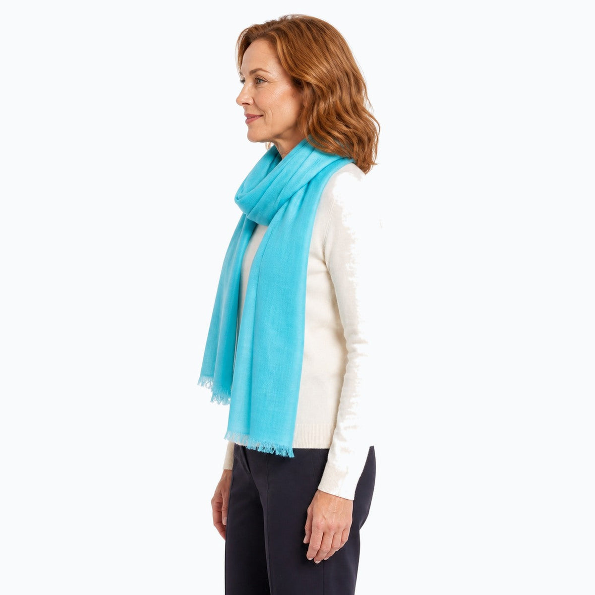 Woman wearing the Claire Powell Aqua Silk Wool Scarf, side view