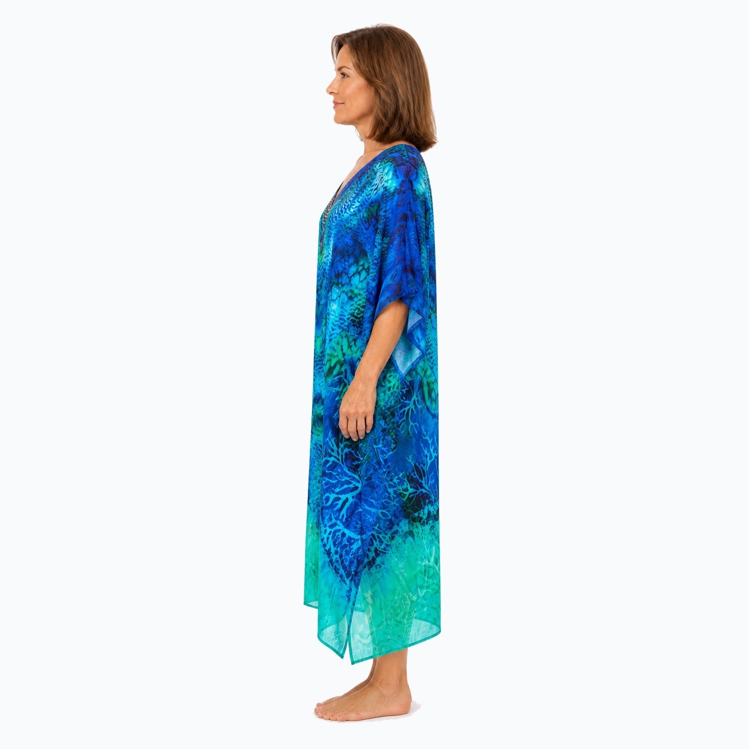 Claire Powell Aquatica midi kaftan dress on a mature woman, side view