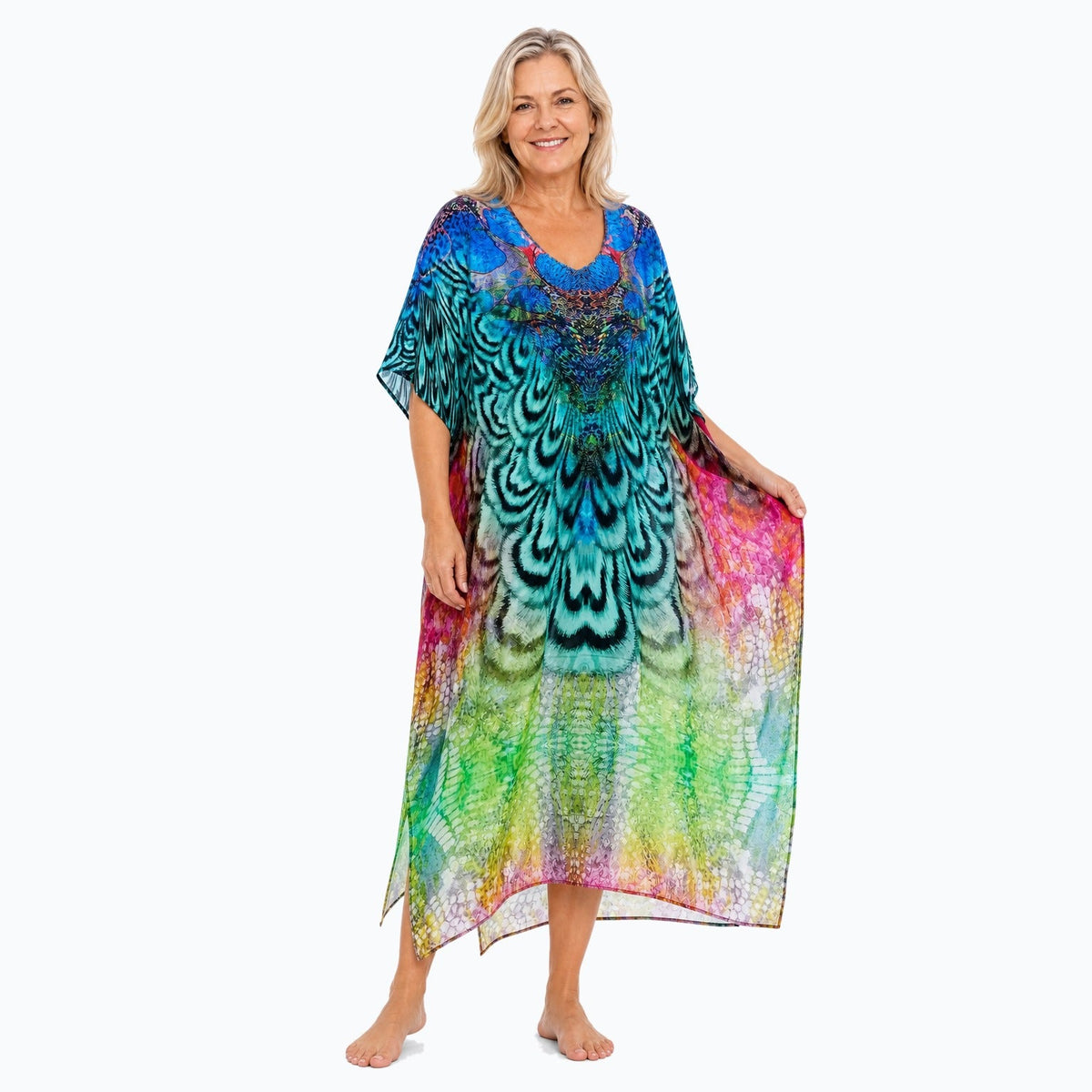 Claire Powell Aves midi kaftan dress on a mature woman, fabric-showing pose