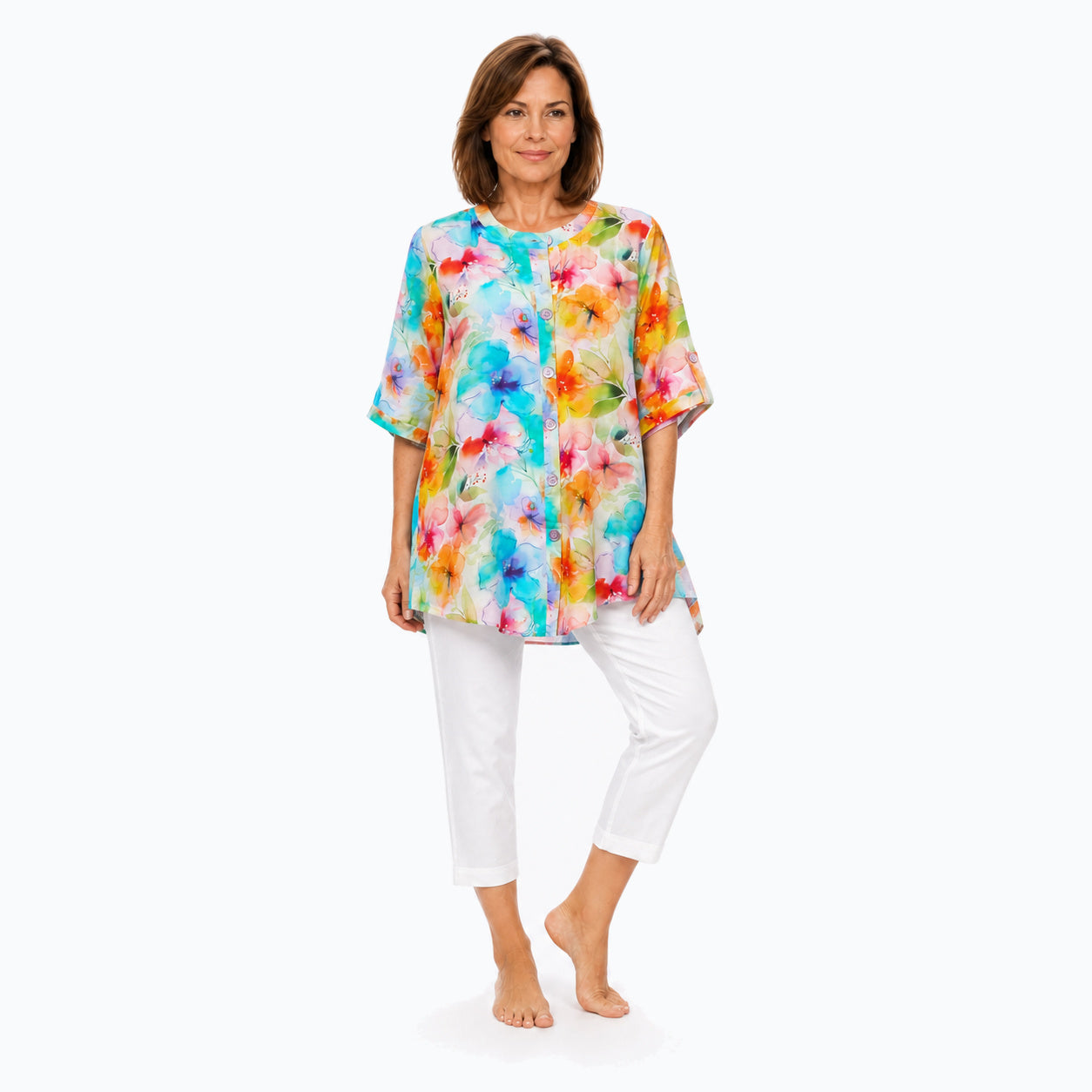 Woman wearing the Claire Powell Blushing A-Line Tunic Shirt with white capri pants, full-body view