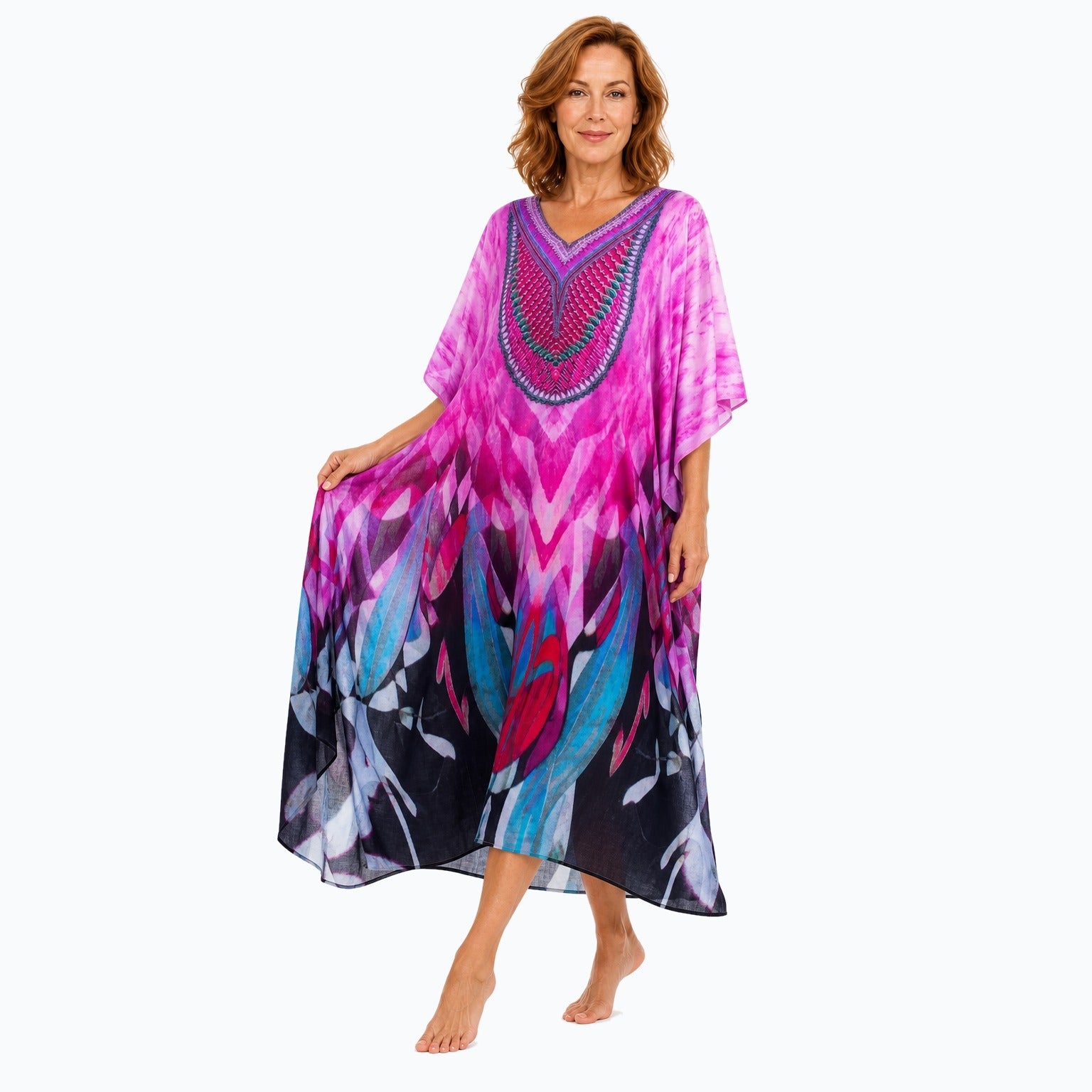 Claire Powell Brazen midi kaftan dress on a mature woman, fabric-showing pose