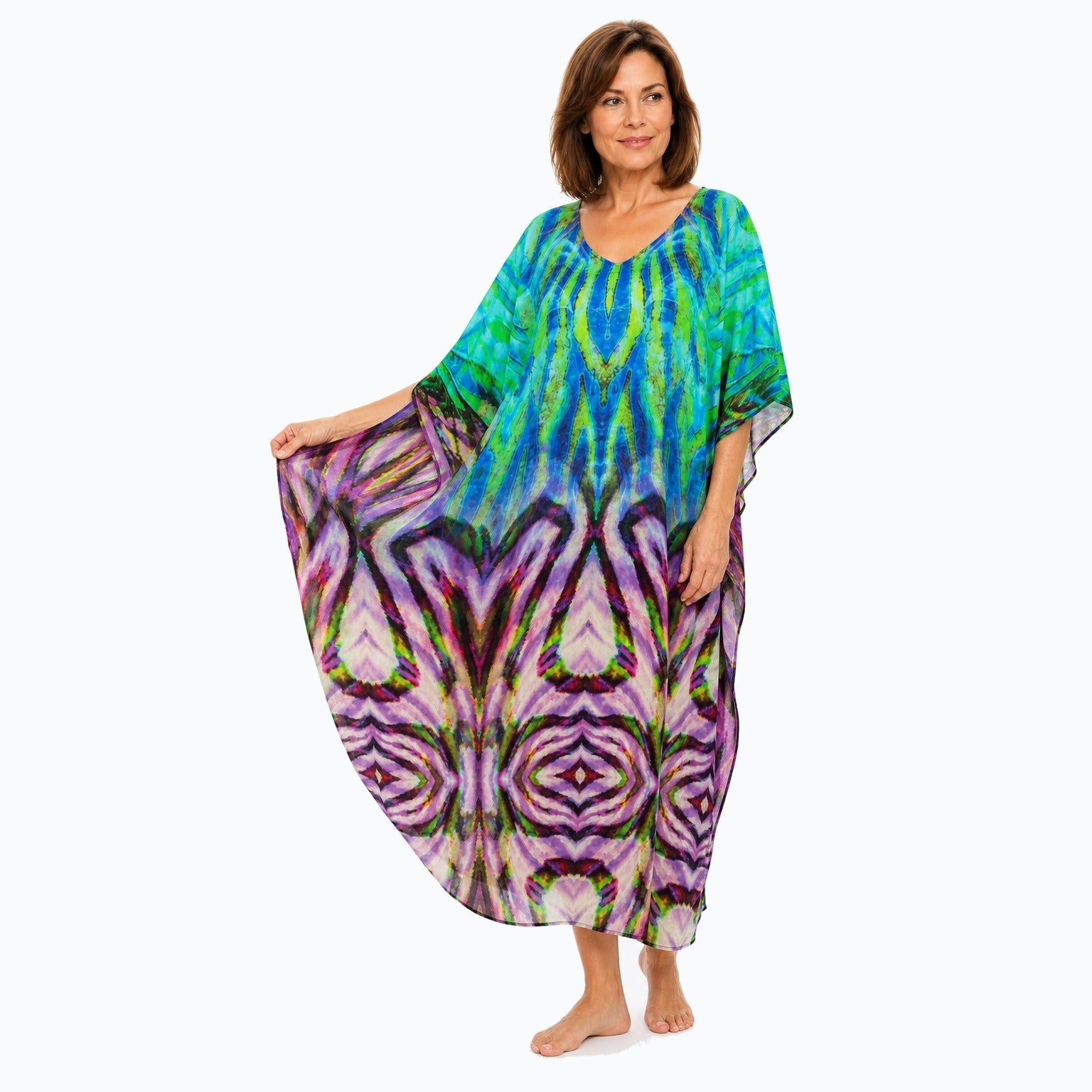 Claire Powell Cascade midi kaftan dress on a mature woman, fabric-showing pose