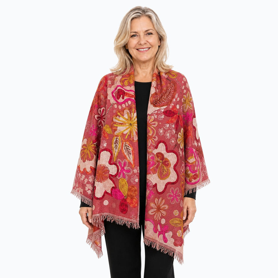 Woman wearing the Claire Powell Coral Wool Shawl, front view