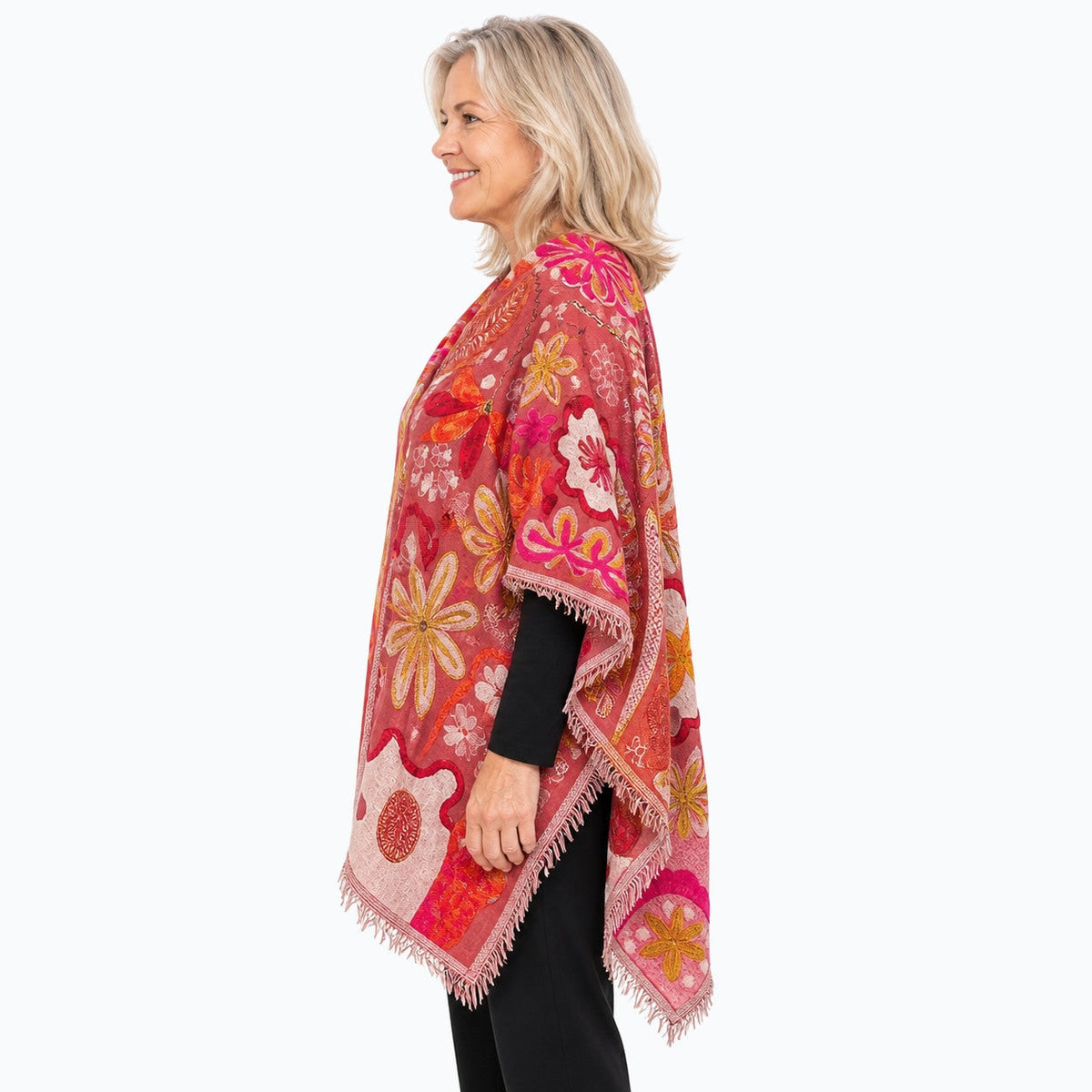 Woman wearing the Claire Powell Coral Wool Shawl, side view